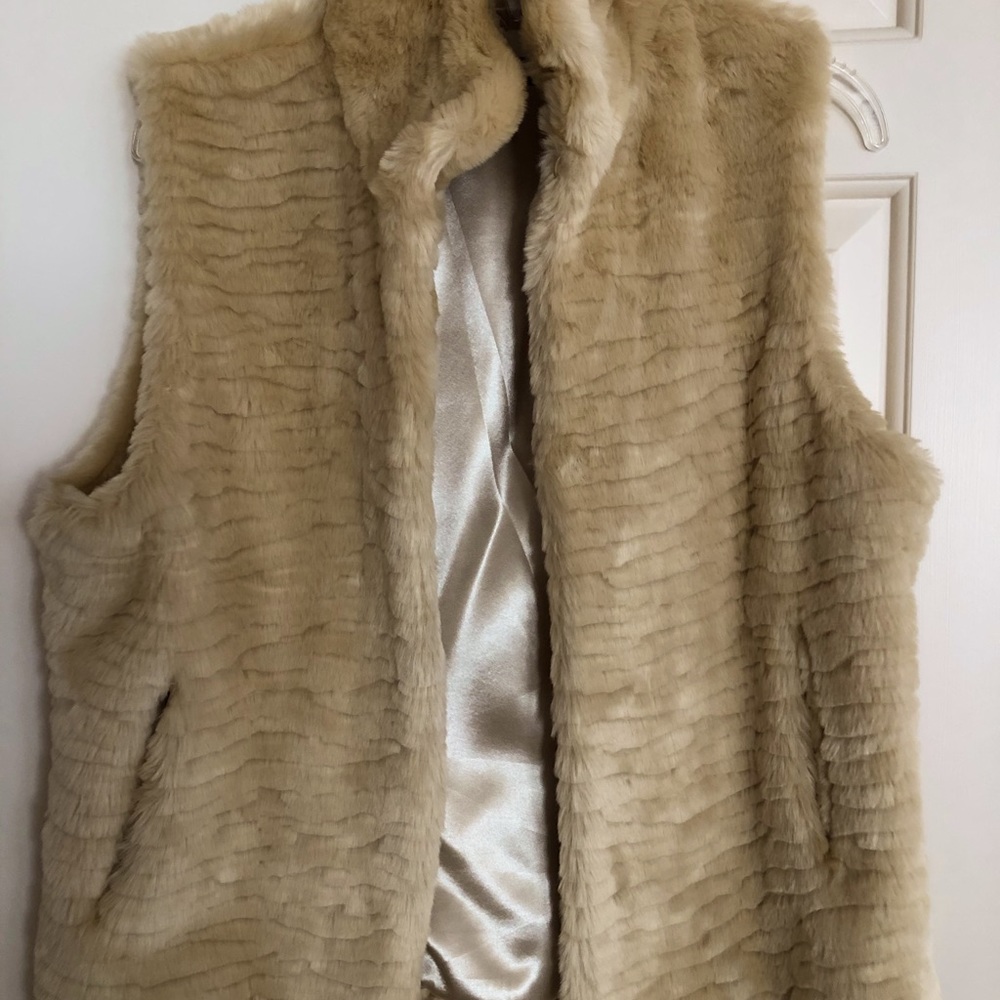 Warm cream colored vest with silk lining